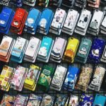 A colorful collection of various cartoon-themed phone cases arranged in rows, perfect for mobile accessory enthusiasts.